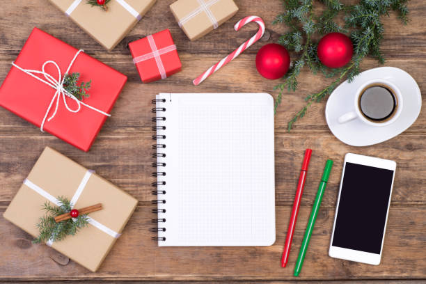 istock Blank notebook on a desk with Christmas decoration and presents 881061074
