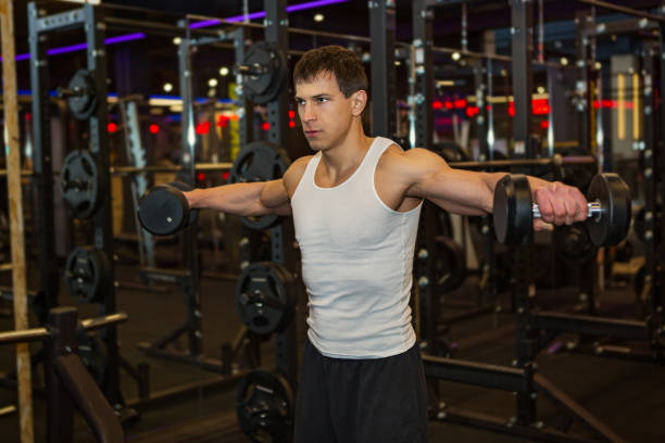 istock Young muscular man  in gym 881063760