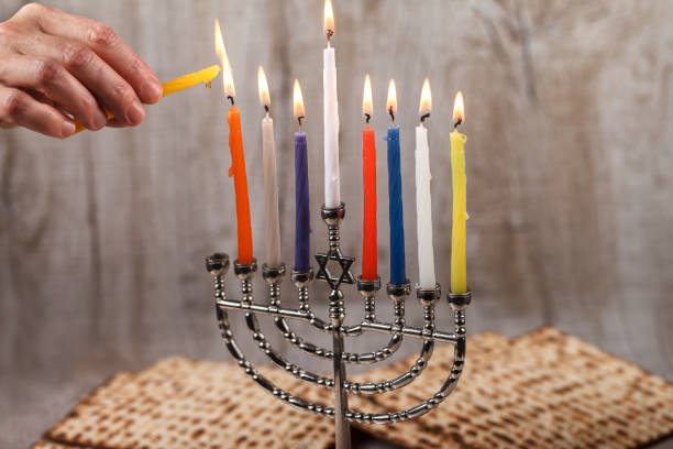 istock Menorah with candles for Hanukkah on a light wooden background 881063998