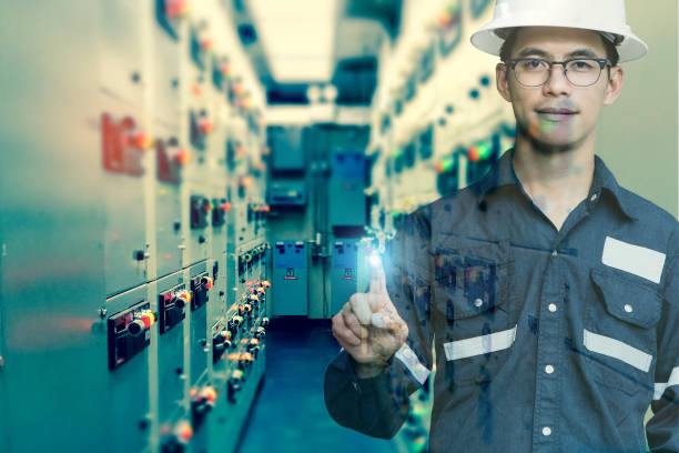 istock Double exposure of  Engineer or Technician man press his finger action in switch gear electrical room of oil and gas platform or plant industrial for monitor process, business and industry concept. 881068256