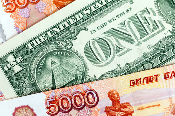 istock The US dollar and Russian five thousand rubles, background 881068350