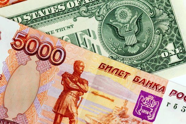 istock The US dollar and Russian five thousand rubles, background 881068370