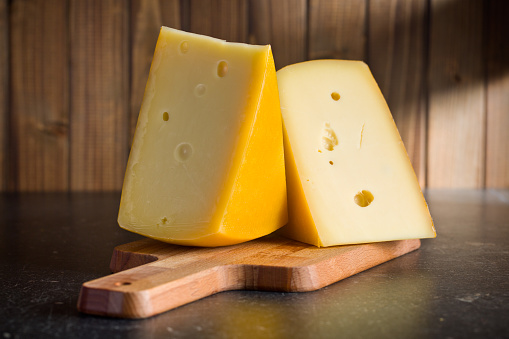 block of edam cheese on kitchen table