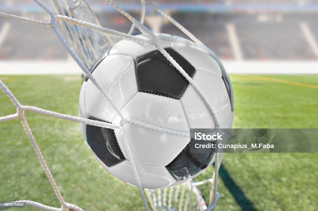 goal at stadium goal with a soccer ball in net at stadium Shooting at Goal Stock Photo