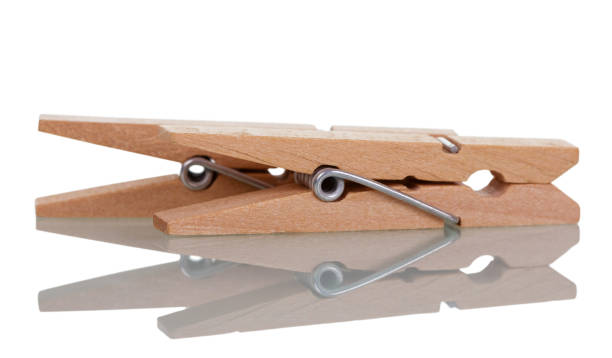 istock Two clothespins are on the table, isolated on white 881083792