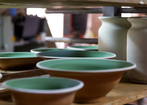 A ceramist craftsman working in his workshop