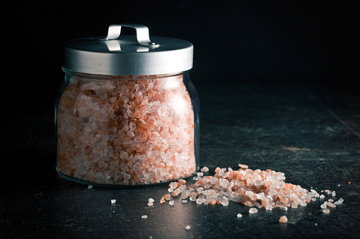 Himalayan salt in jar on kitchen table
