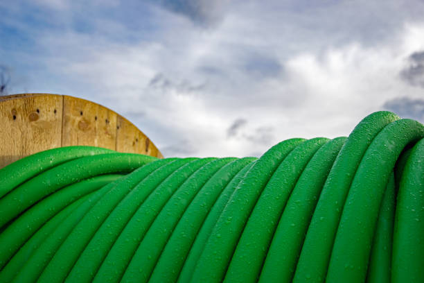 istock Green cables on a reel with waterdrops 881089054