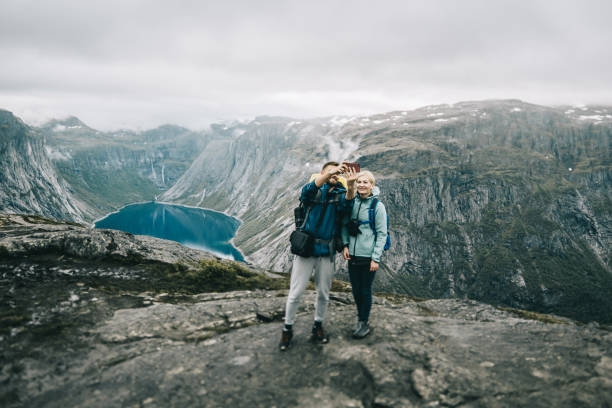istock couple  hikers on mountain, Besseggen Ridge 881089344