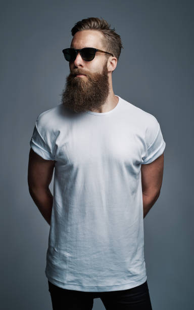 istock Cool young man with a long beard wearing sunglasses 881089862