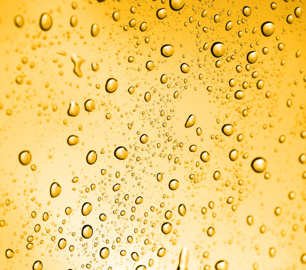 istock golden water drops on glass 881107752