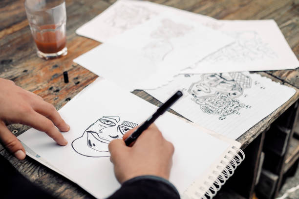 istock Young Graffiti Artist Drawing Sketches Outdoors 881108044