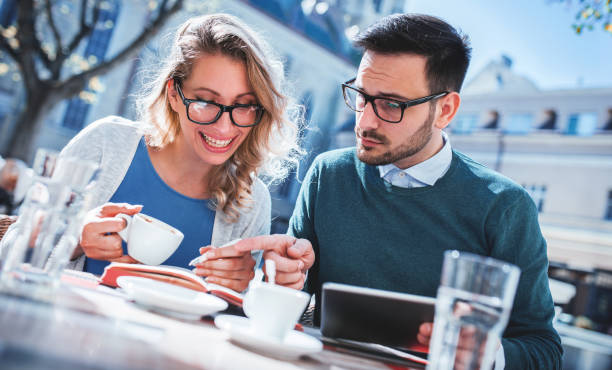 istock Young students on coffee break in the cafe. Love, dating, technology, education, lifestyle 881108356