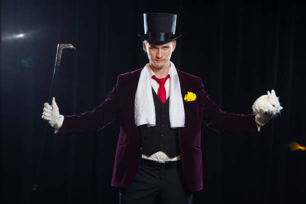 istock Magician with rabbit, Juggler man, Funny person, Black magic, Illusion on a black background 881108748