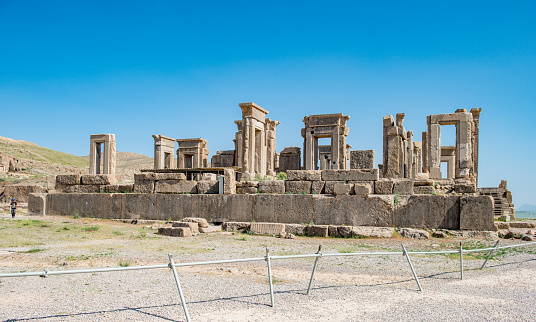 View of ancient Erechtheion temple on Acropolis hill in Athens against clear blue sky