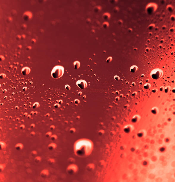 istock brown water drops on glass 881118158