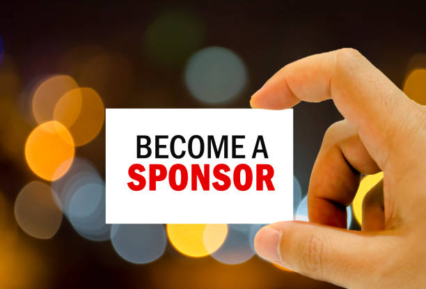 become a sponsor written on business card stock photo