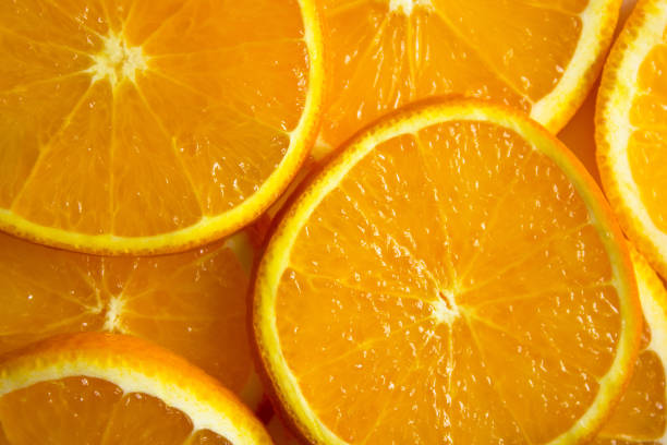 istock bright orange background from slices of juicy oranges 881120856