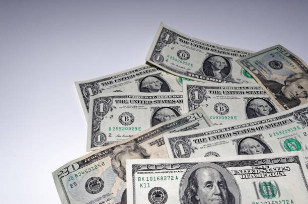 istock American dollars are laid out 881121522