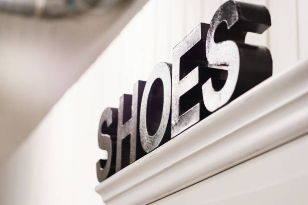 istock Cut out from the tree black caps from which the word Shoes is collected. 881124486