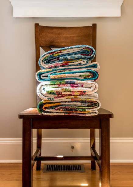 istock Folded End of Quilts on Kitchen Chair 881124820