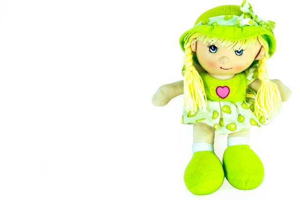 stuffed soft sitting funny pig-tailed green-headed doll isolated over white