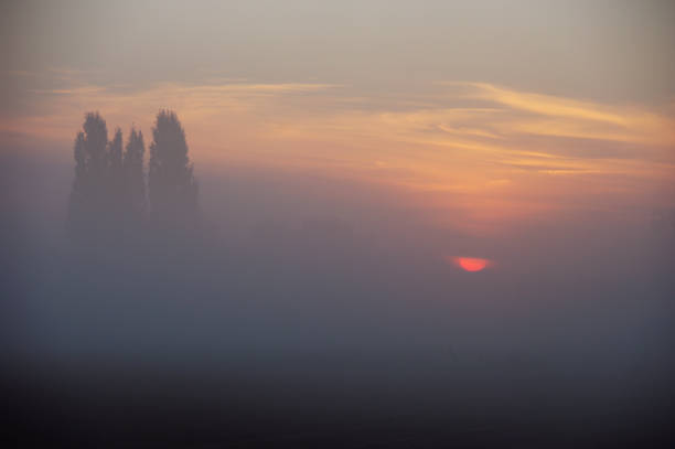 istock Sunrise setting in the country 881130922