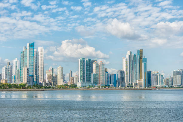 Panama city skyline Panorama of Panama city, high buildings against blue sky, in front blue sea. Panama panama city panama photos stock pictures, royalty-free photos & images