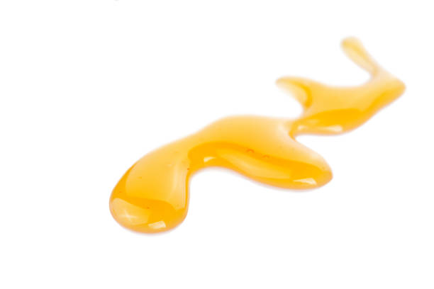 istock A wiggly honey stain on a white background 881147198