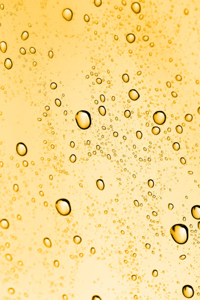 istock golden water drops on glass 881159500