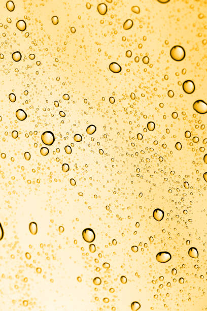 istock golden water drops on glass 881159582