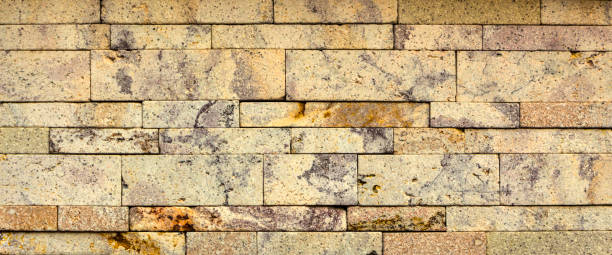 istock Stone wall texture,travertine tiles facing stone 881171418