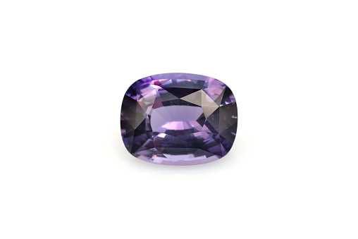 Natural Purple Sapphire gemstone on white background