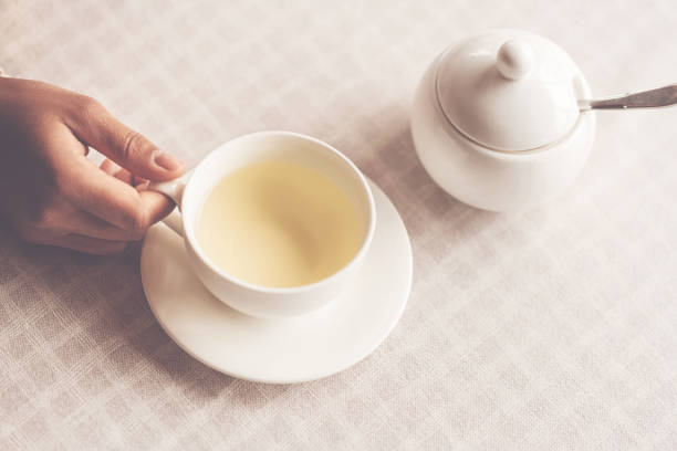 istock Flat lay photo of tea cup standing on the table 881186388