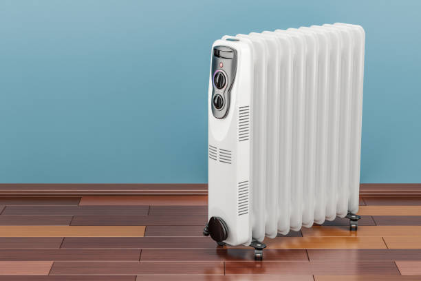 Electric oil heater, oil-filled radiator on the floor. 3D rendering Electric oil heater, oil-filled radiator on the floor. 3D rendering wood burning stove stock pictures, royalty-free photos & images