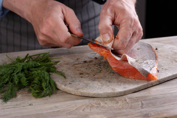 istock Removing skin from salted salmon 881201440