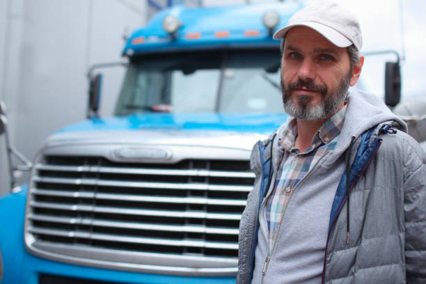 Mature bearded man against retro styled truck