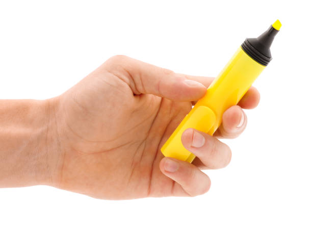 istock Hand with yellow open marker isolated on white background 881205628