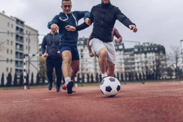 istock Friends Playing Football 881215484