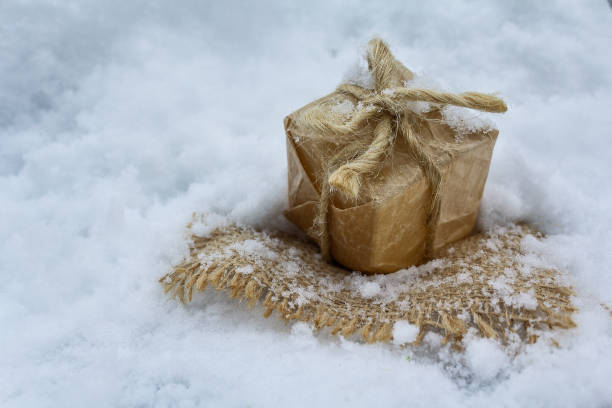 istock Gift in retro style on white snow. Christmas 881218442