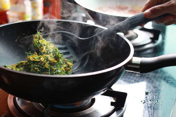 istock Sesbania cooking with smoke on a pan 881248890
