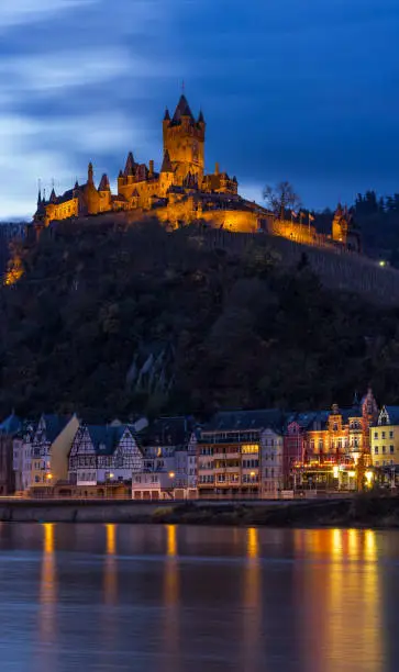 Cochem Village Valley at sunset showing Moselle Riverbank with the Cochem Castle in Background at sunset