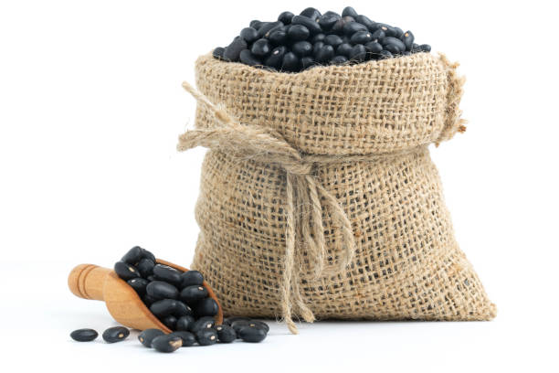 istock black beans in canvas sack on white background 881255914