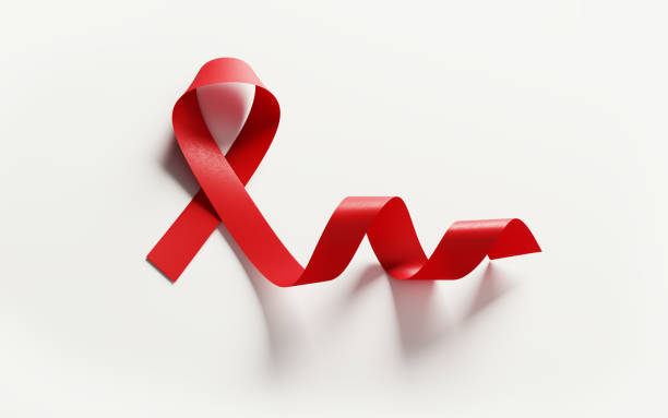лента осведомленности о спиде на белом фоне - aids awareness ribbon фотографии стоковые фото и изображения