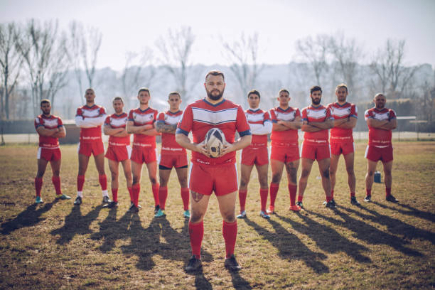 Rugby team Young and strong rugby team on the field, standing together in a row.
 rugby team stock pictures, royalty-free photos & images