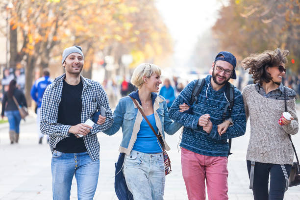 istock Friends holding hands and hanging out 881281100