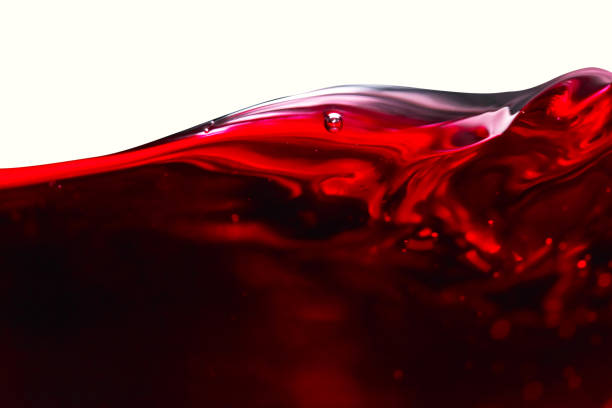 赤の背景に白ワイン - wineglass red wine wine liquid ストックフォトと画像