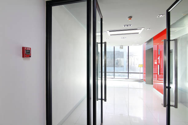 istock Fire alarm near first  floor elevator and emergency exit of the building 881302160