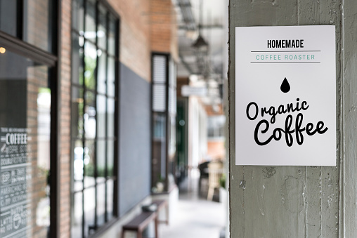 Organic coffee advertisement on a wall