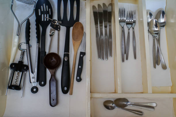istock close up kitchenware and utensils in cabinet 881318832